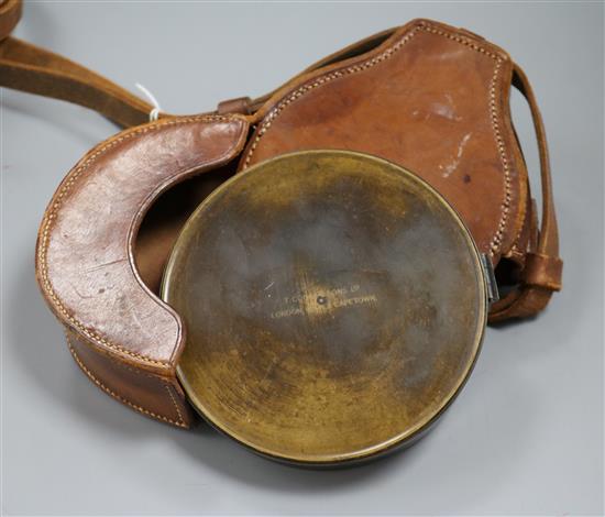 A leather cased compass, by T Cooke and Sons, London, New York and Capetown